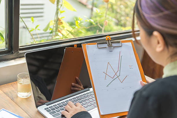istock Lady working attentively on laptop at her lovely working-place 585048466