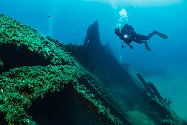 Scuba diver point of view. Wreck diving over a shipwreck.