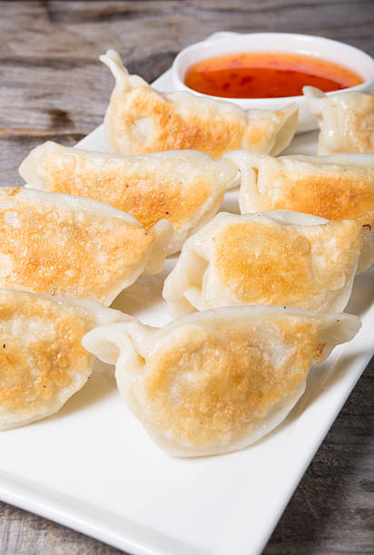 istock Fried dumplings with chili sauce 585051308
