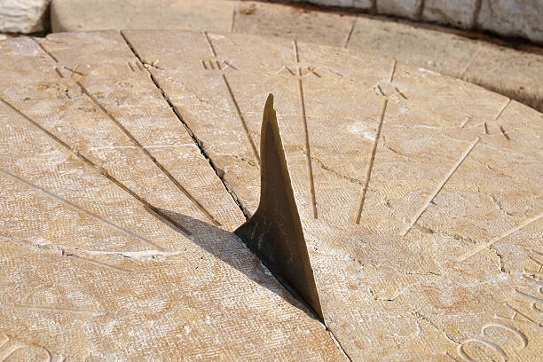 Ancient sundial The picture was taken in Spain, in the street of the ancient city of Tarragona. Pictured Roman sundial. ancient sundial stock pictures, royalty-free photos & images