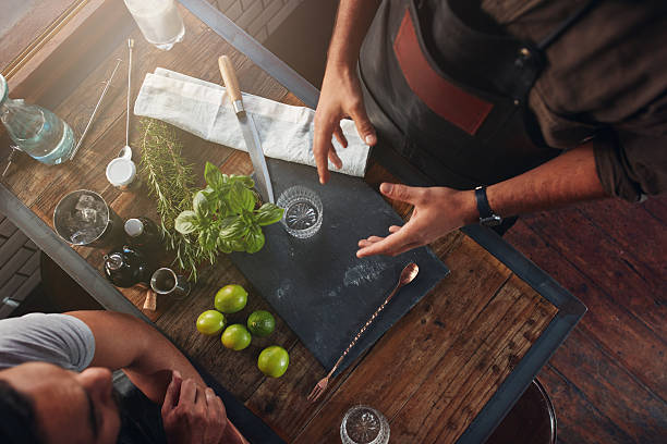 istock Bartenders discussing about new cocktail recipe 585054724