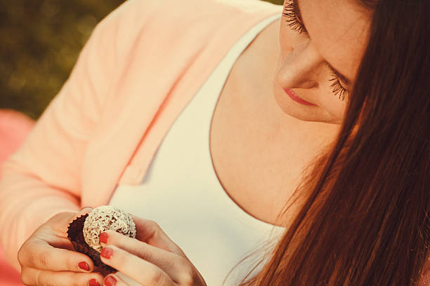 istock Woman with liitle cookie cupcake. 585056094