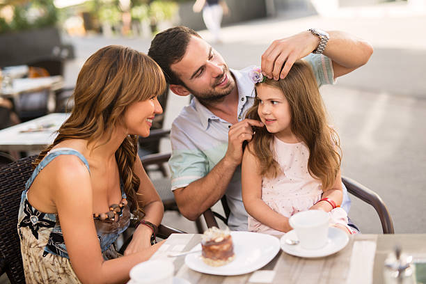 istock Young loving family having fun in a cafe. 585056542