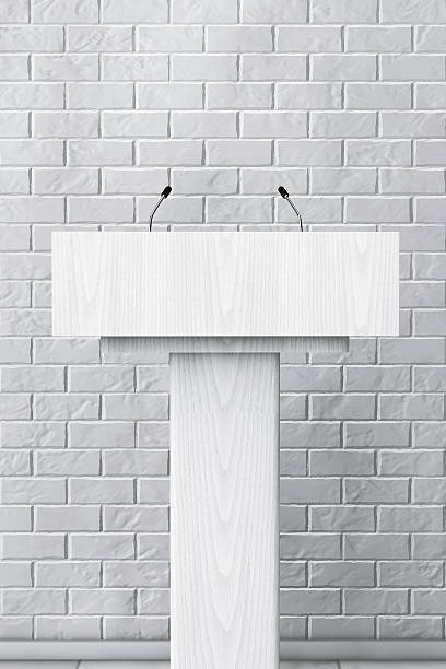 istock White Podium Tribune Rostrum Stand with Microphones. 3d Renderin 585056680