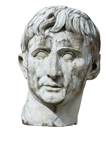 Roman sculptural work, head of a Caesar, roman emperor. Antique classic marble statue. Isolated on white with clipping-path.