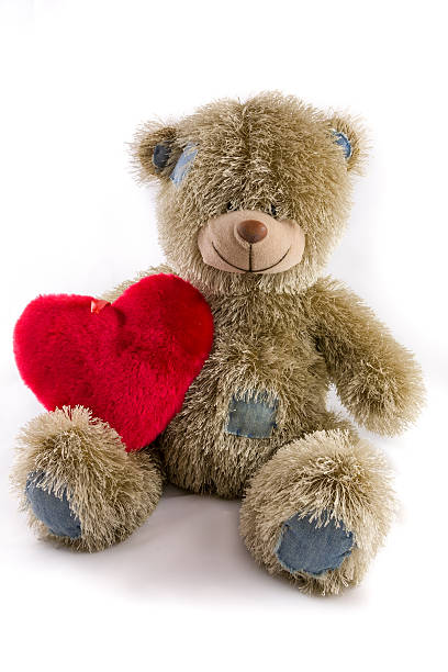 istock Teddy Bear with Patches and Heart 585058344