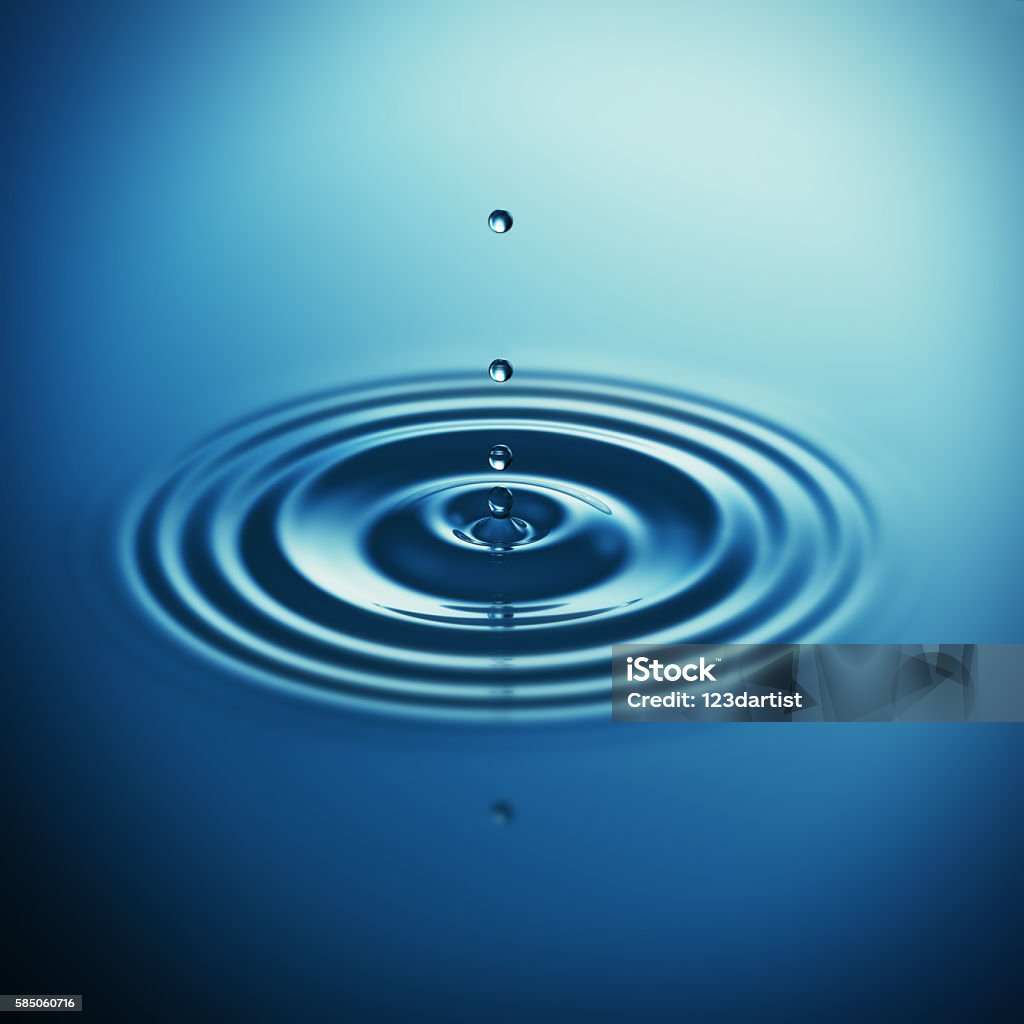Falling water drop makes waves Falling blue water drop splash - blue background Water Stock Photo