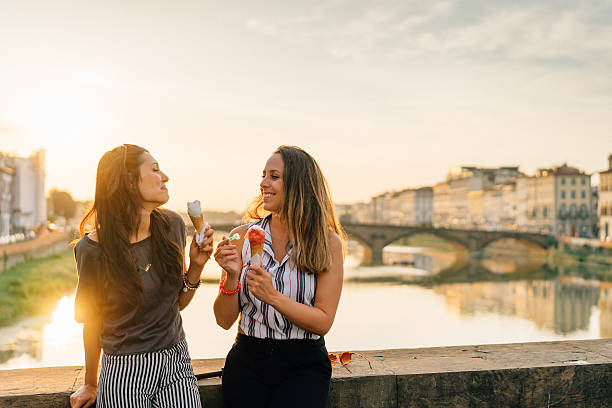 young friends portrait while eating ice-cream - bridge people fun river imagens e fotografias de stock