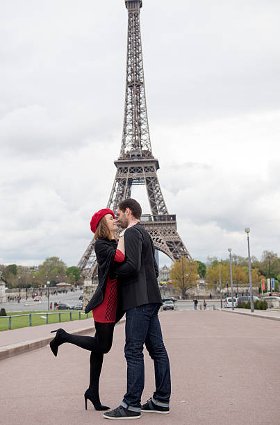 istock Romantic couple embracing in front of the Eiffel tower 585062754