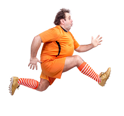 recreational footballer running isolated on a white background