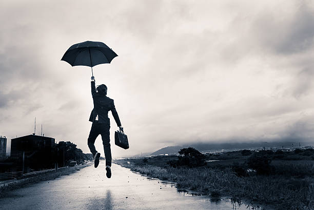 istock businessman are holding an umbrella 585066818
