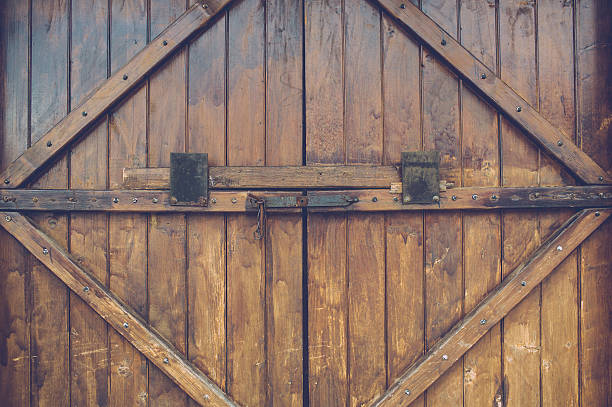istock Old wood door with metal handle 585069122