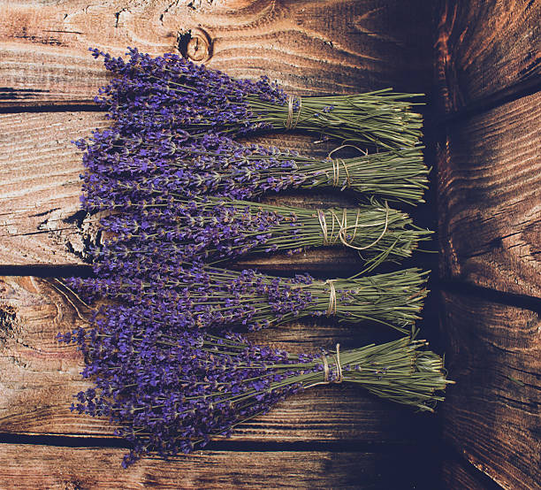 istock Lavender bunch on wood background 585069376
