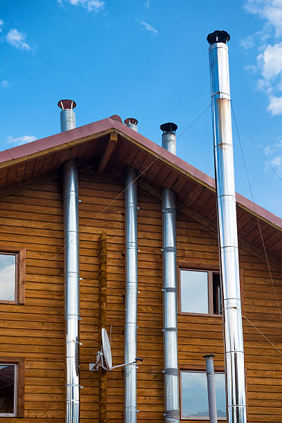 istock Wooden house with modern chimney 585069704