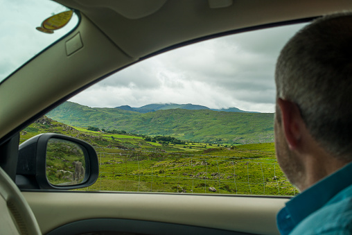 View out of car window of Wild Atlantic Way, Ring of Kerry, Co. Kerry, Ireland. 