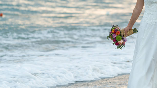 海辺を歩く花嫁 - bride women standing beauty in nature ストックフォトと画像