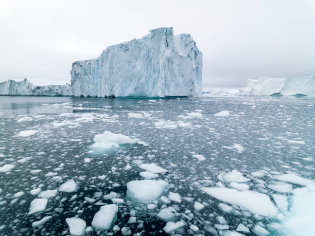huge glaciers are on the arctic ocean in ilulissat, greenland - icecap imagens e fotografias de stock