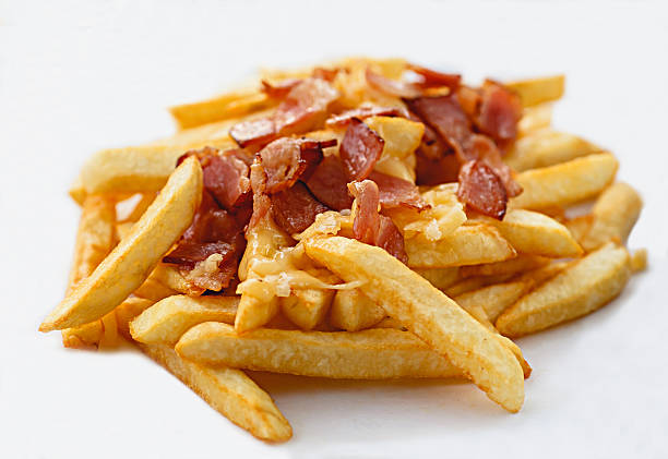 istock French fries with bacon and cheese 585073328