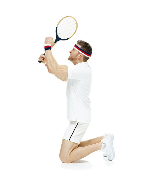istock Tennis player celebrating on his knees 585075434