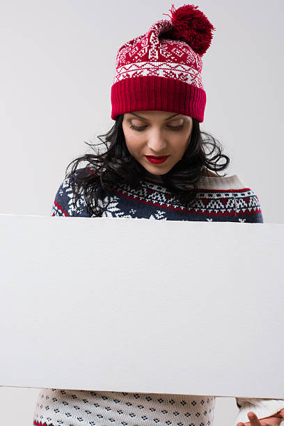 istock Winter woman holding copyspace 585075698
