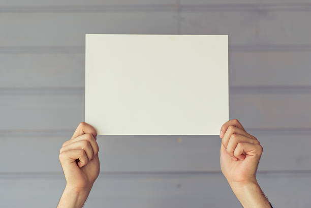 istock Hands with sheet of paper 585077378