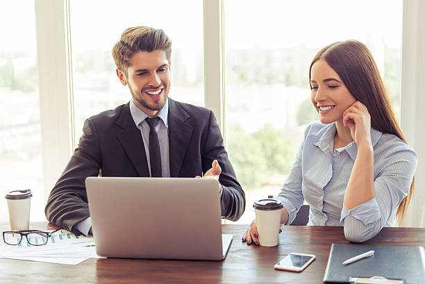 istock Beautiful business couple working 585077792
