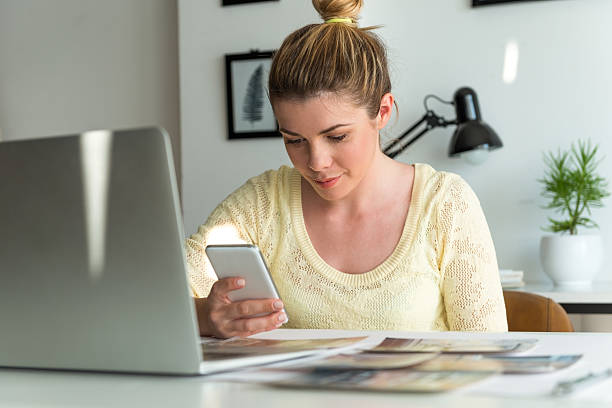 istock Young woman using mobile phone 585078258