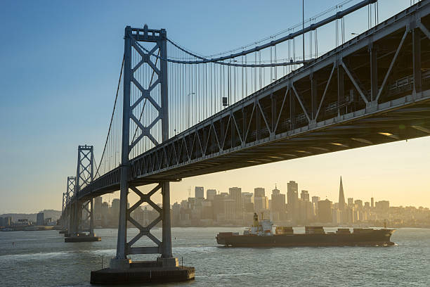 istock Container ship sails along San Francisco Bay at sunset 585081696