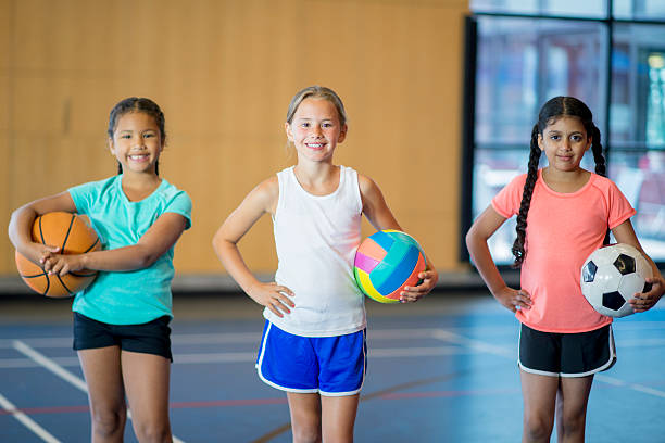 istock Elementary Age Girls Playing Sports 585084456