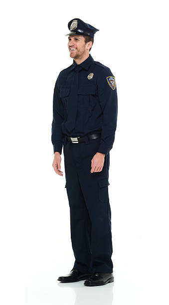 istock Smiling police standing and looking away 585090580