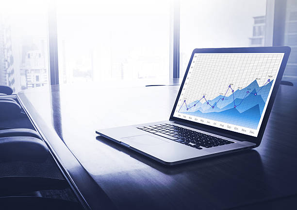 istock Business graph chart on laptop in modern blue conference room 585091362