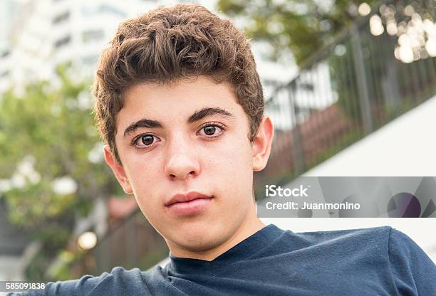 Pensive Teenager Stock Photo - Download Image Now - Outdoors, Teenage Boys, West Asian Ethnicity