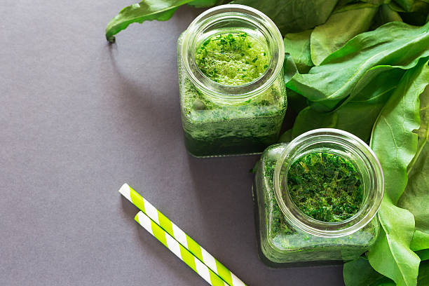 istock Healthy green sorrel and spinach smoothie in glass jar 585092192