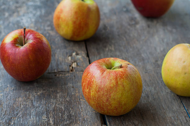 istock red apples on wooden rustic background 585092262