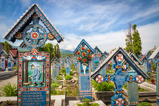 SAPANTA, ROMANIA - MAY 16, 2015 - Colorful, painted, wooden tombstones at Merry Cemetery, 