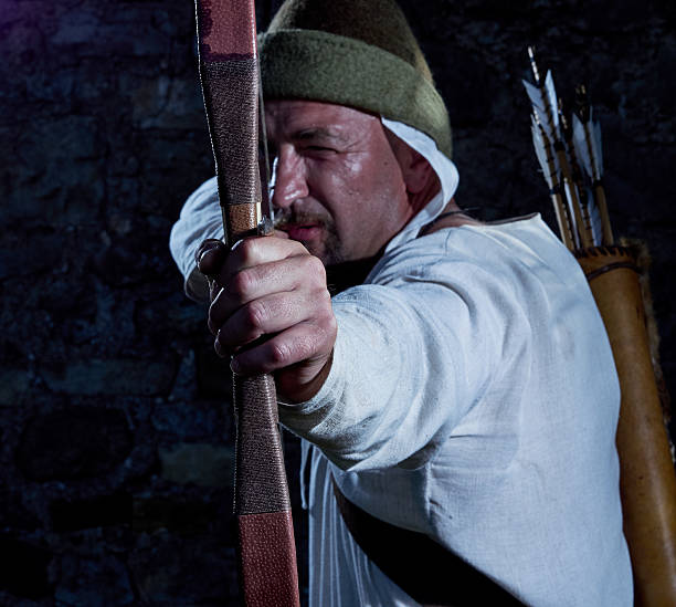 Medieval archer with a bow and arrows stock photo