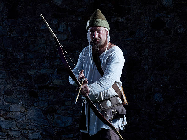 istock Medieval archer with a bow and arrows 585093252