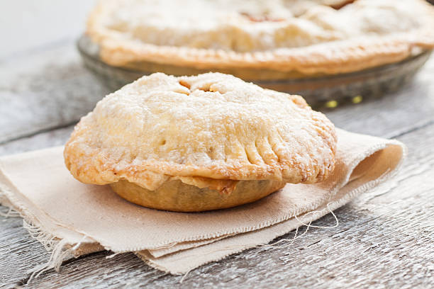 istock American apple pie on wooden rustic background 585145156