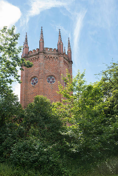 istock historic tower, with poles and colored glass windows 585147996