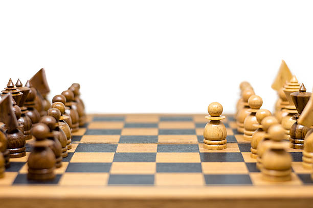 istock wooden chess board on white background 585148486