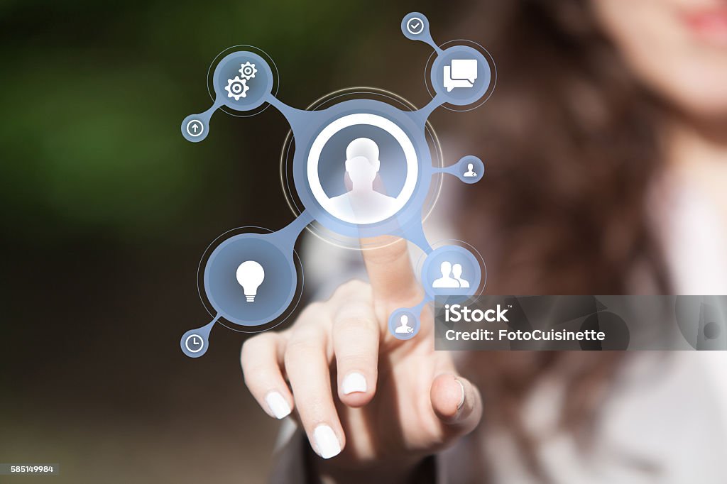 Business team connecting. Team communicating over social network chat programs. Hand pressing customer service support icon on touch screen. Customer Relationship Management Stock Photo