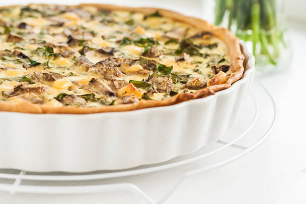 tart with mushrooms, a spinach and cheese stock photo