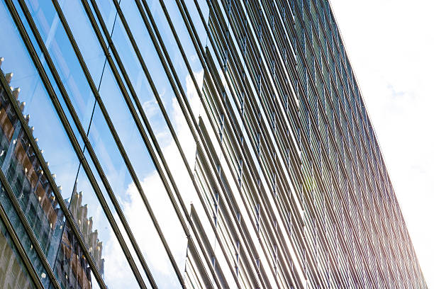 istock Modern Business buildings with sky background and sun 585150460