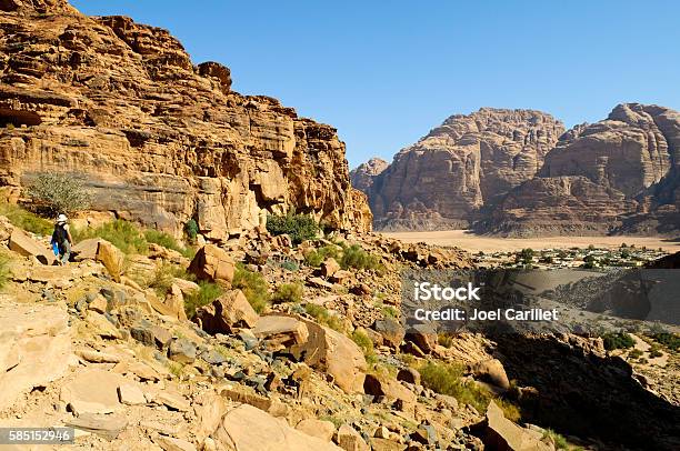Tourist Hiking In Wadi Rum Jordan Stock Photo - Download Image Now - Hiking, Jordan - Middle East, Backpack