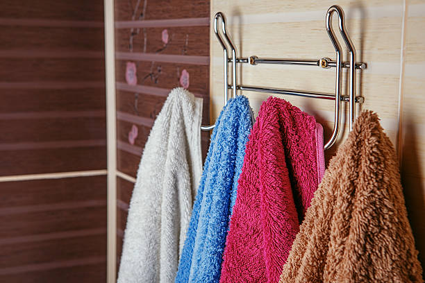 istock Clean Colored towels hanging on the rack in the bathroom. 585153806