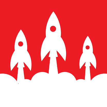 Vector illustration of three white rockets blasting off on a red background.