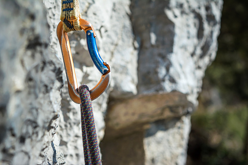 Carabiner, spit and climbing rope. Free climbing gear
