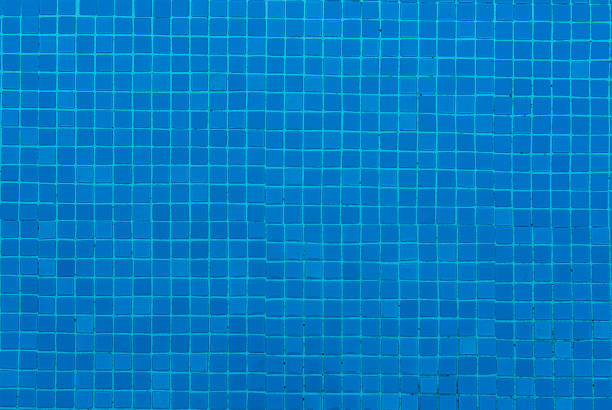 istock Blue ceramic tile mosaic in water pool photo 585156948