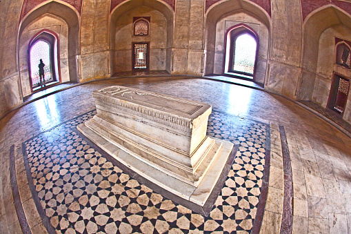 Delhi, India - November 11, 2011: marble tomb inside  Humayuns tomb in Delhi, India. The tomb was commissioned by Humayun's first wife Bega Begum in 1569.