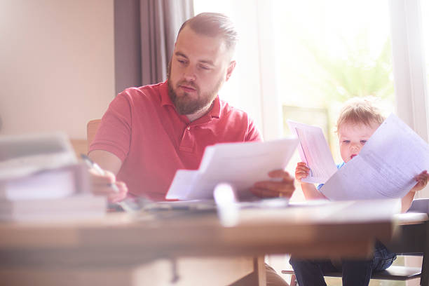 istock Young father working from home with toddler 585158310